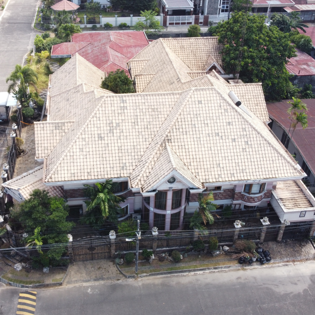 Clean residential tile roof restoration using low-pressure softwashing techniques to remove moss and algae.